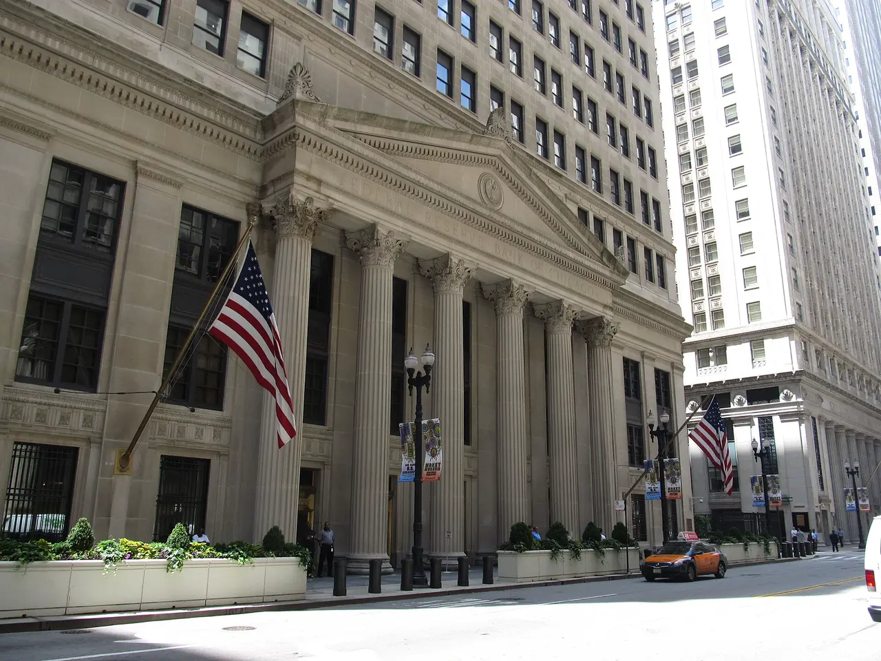 The Federal Reserve Bank of Chicago, a tall stone building on a city street